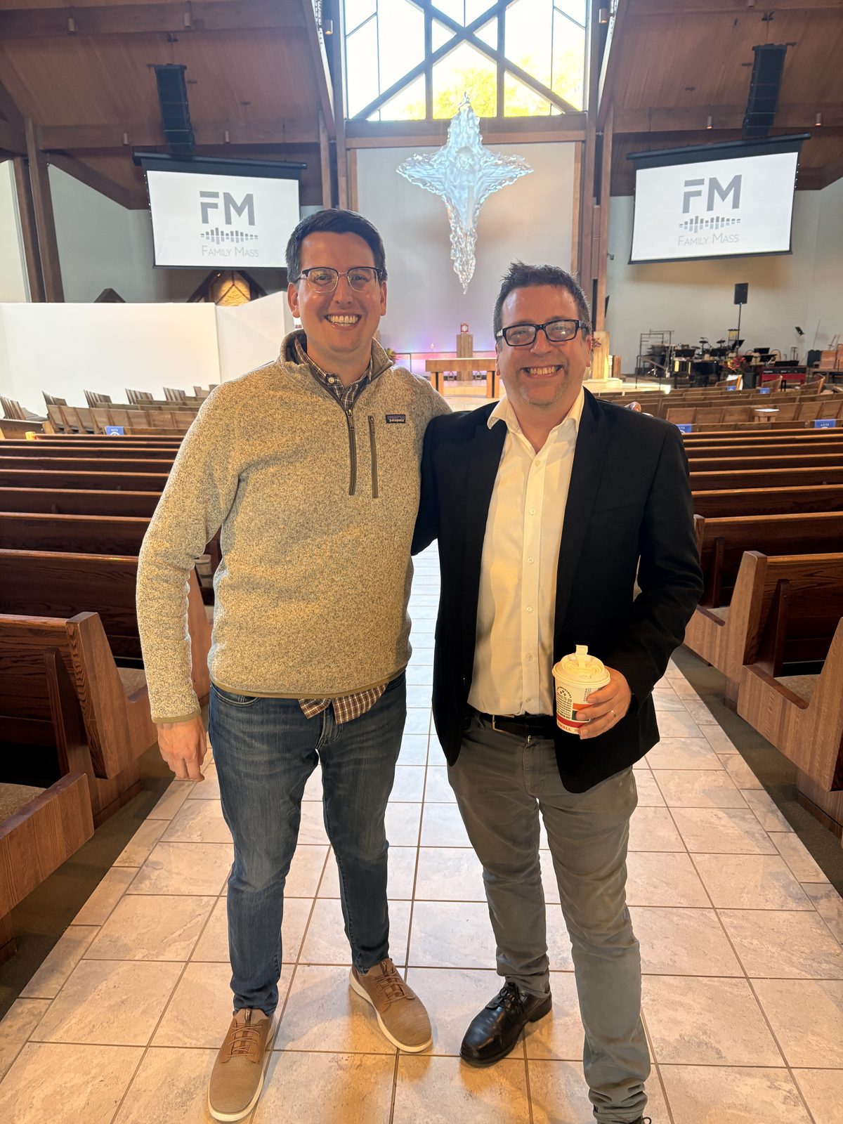 Jim Schiffer and Ken McMullen standing together in the Holy Family worship space
